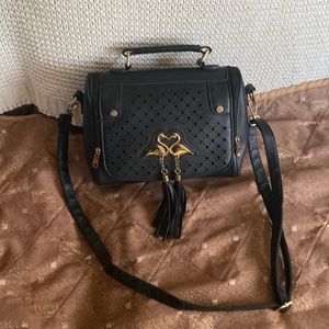 Cute shoulder bag two zippers clean no rips tears two hanging tassels